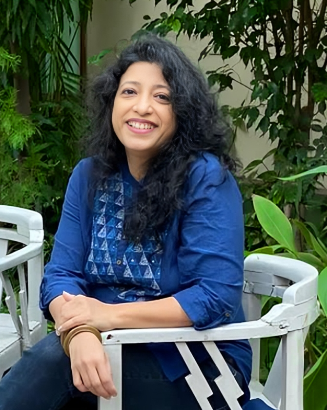 Portrait of Olyve with projected letters